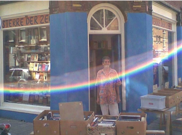 Painter Jan van Eijk in front of his bookstore